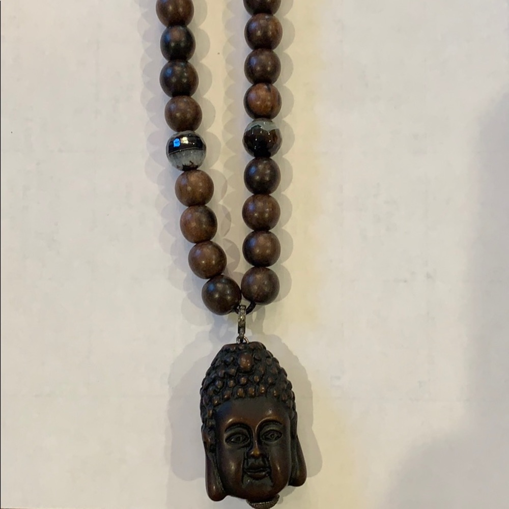 Beaded wooden necklace with Buddha charm.